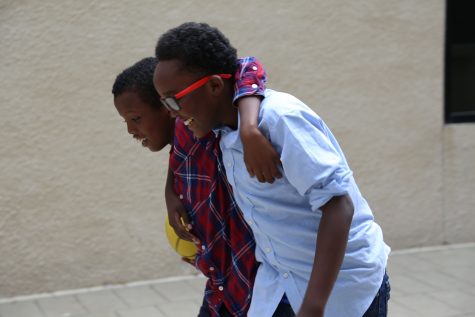Musa Ali (left) and Abdullahi Abdullahi (right) walk home after playing basketball at the local park.“Once people learn about our community, they’ll know that we’re not that different,” Abdullahi said.