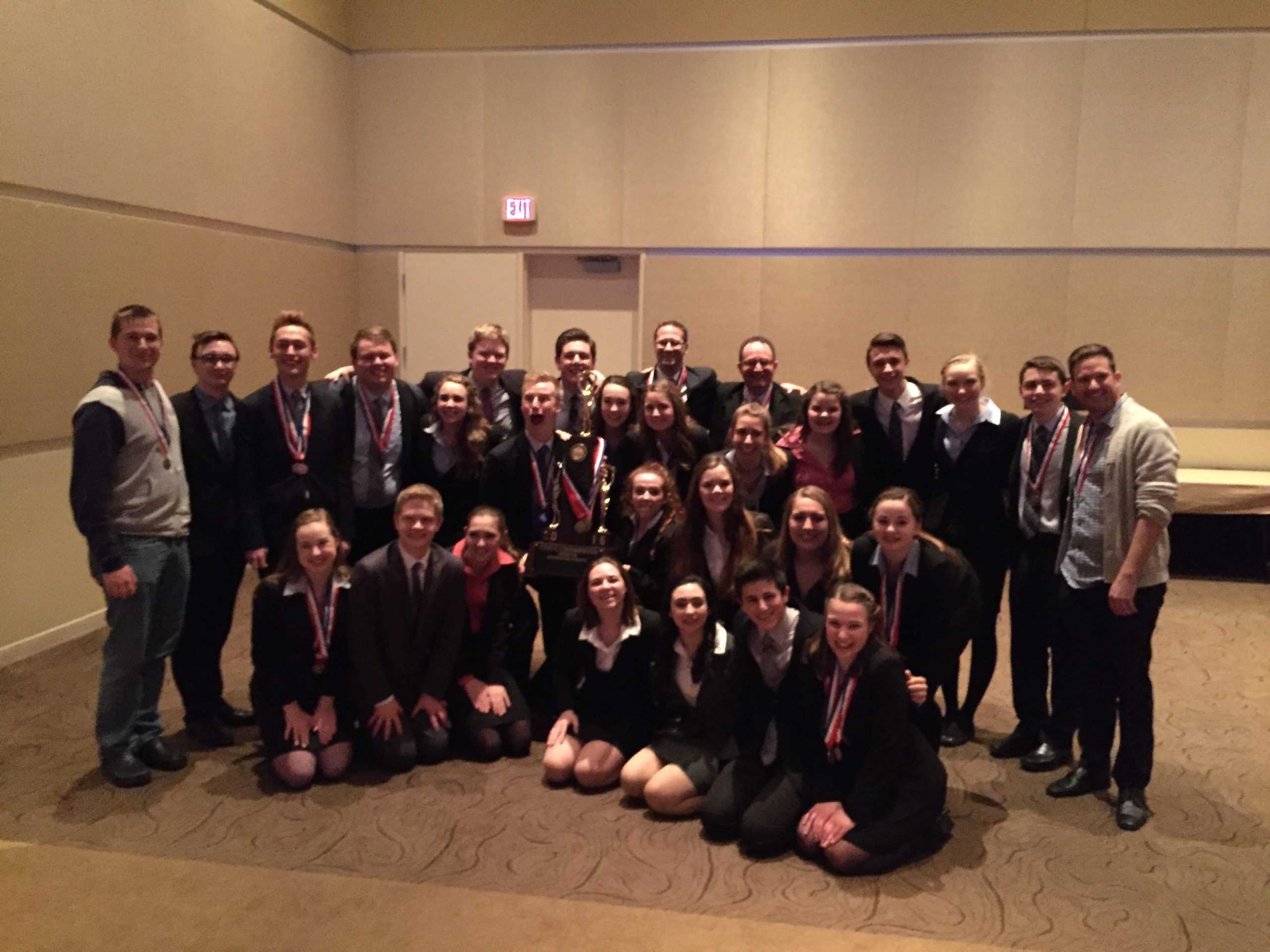 Speech team poses after receiving state title.