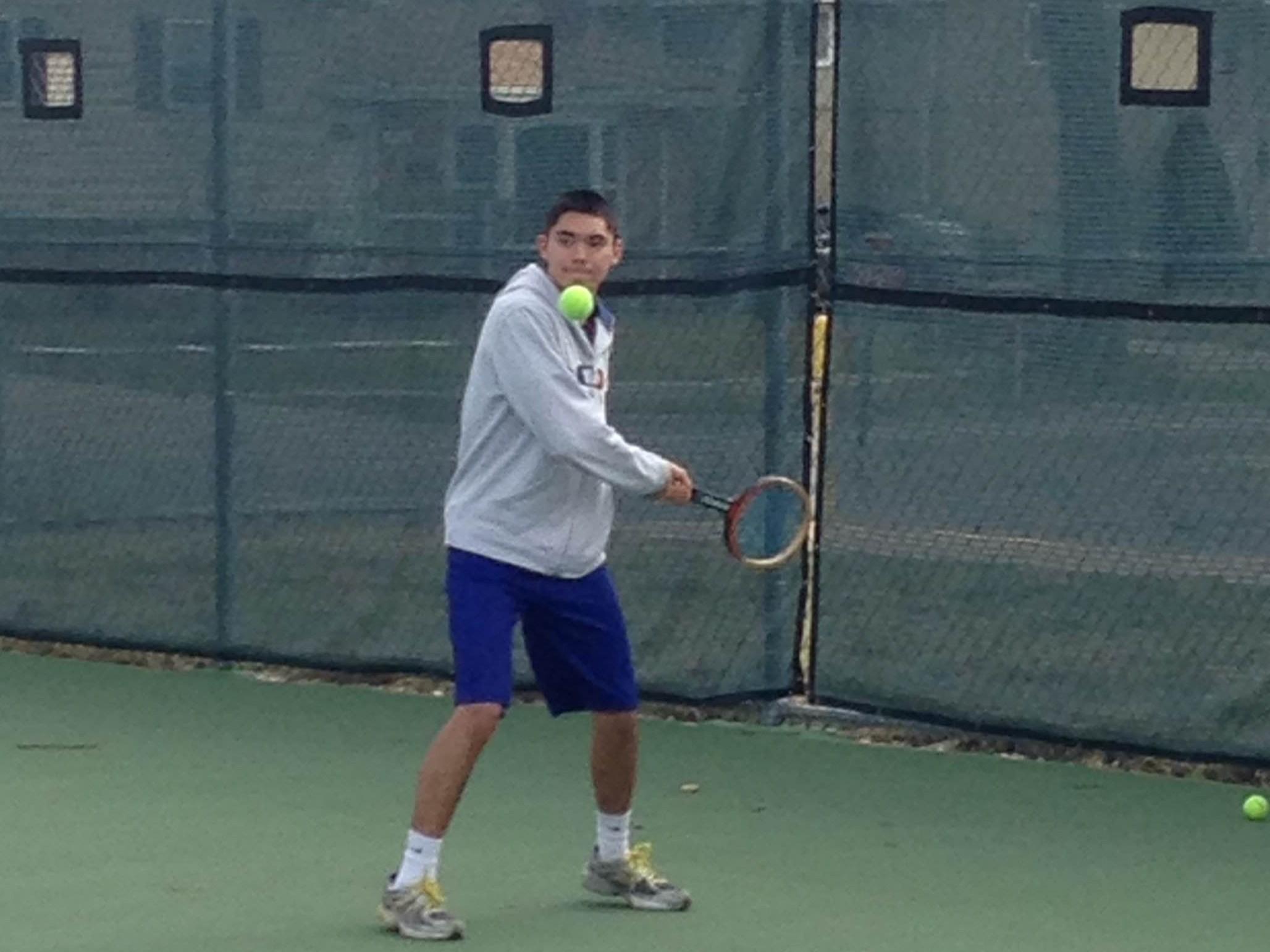 Senior Steven Norton practices his different shots under the supervision of new coach Brad Rathe. (photo courtesy of Brad Rathe)