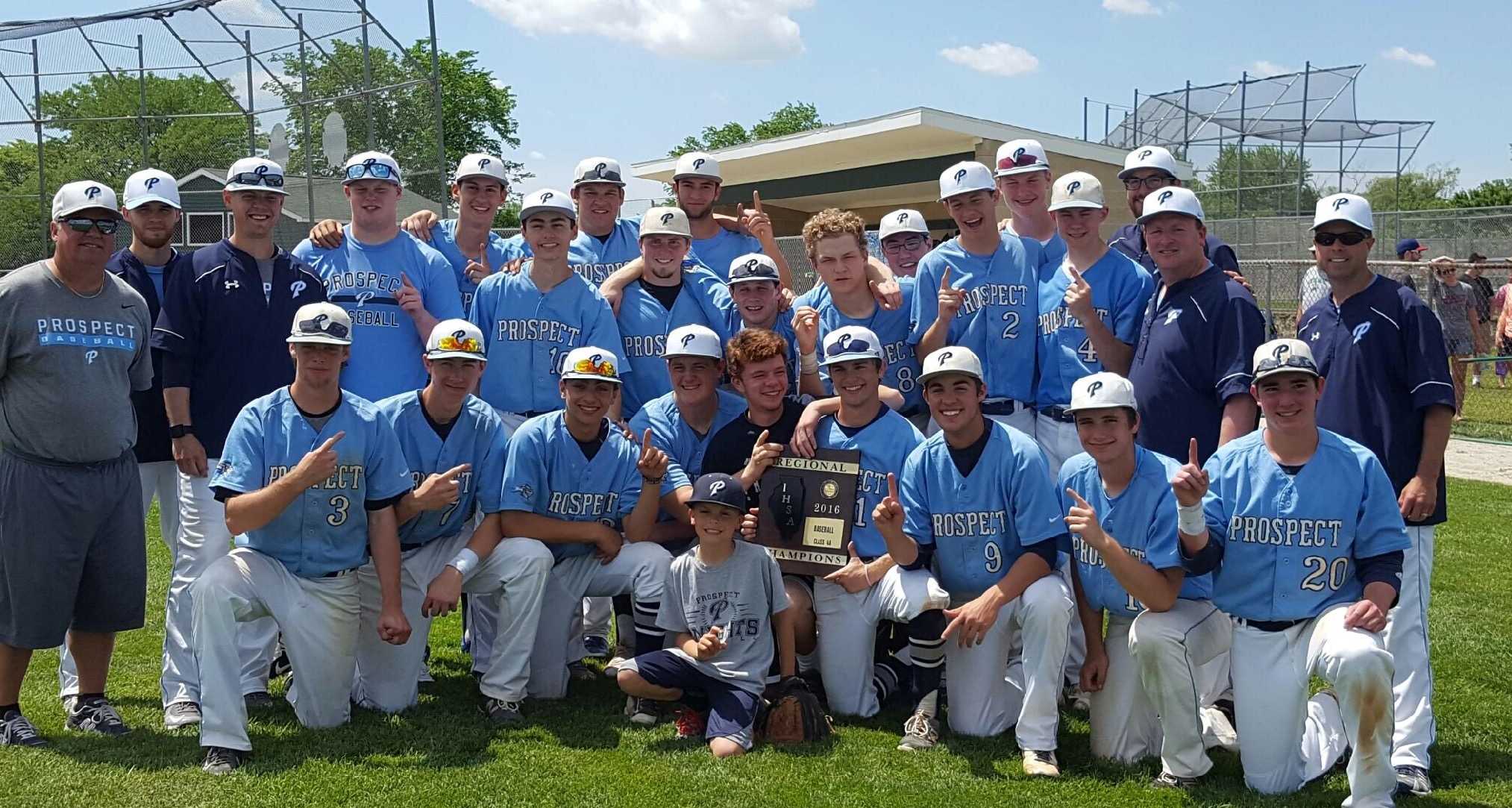 Boys' baseball poses with the regional championship trophy. Winning the regional was the team's goal, and they accomplished this on May 30 by beating Glenbrook North 3-0.
