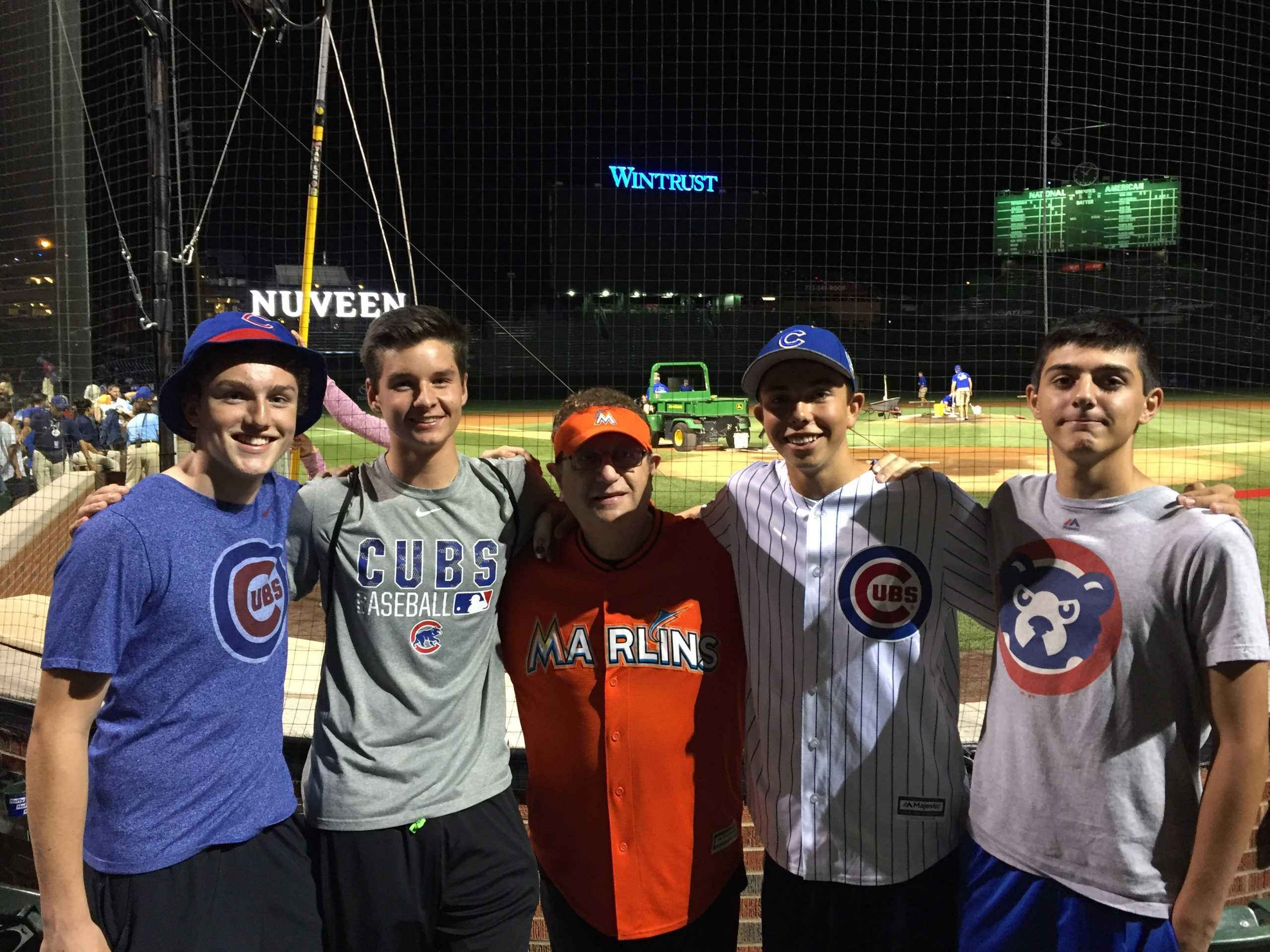 Writer Jack Ankony (center), a junior, and his friends pose with the Marlins Man at a Cubs game at Wrigley.