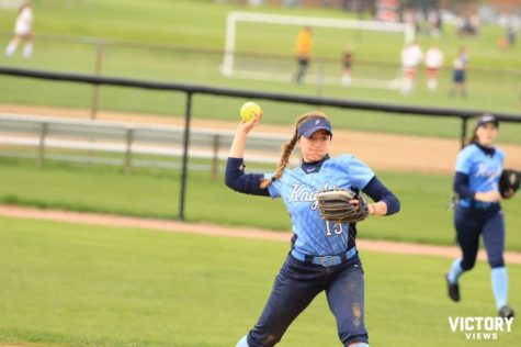 Junior Lauren Caldrone throws the ball to first in the Knights game versus Palatine on May 3. Caldrone moved from third base to shortstop for a portion of the season when Junior Alyssa Cacini was sidelined with an ankle injury.
