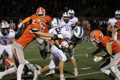 Football Falls to Undefeated Huskies