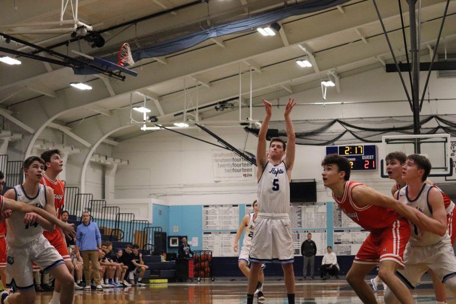 Boys basketball keeps their momentum going with definitive win at home