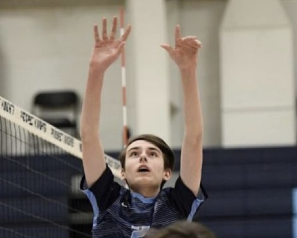 Freshman Ryan Cook goes up to set the ball. (Photo courtesy Ryan Cook)