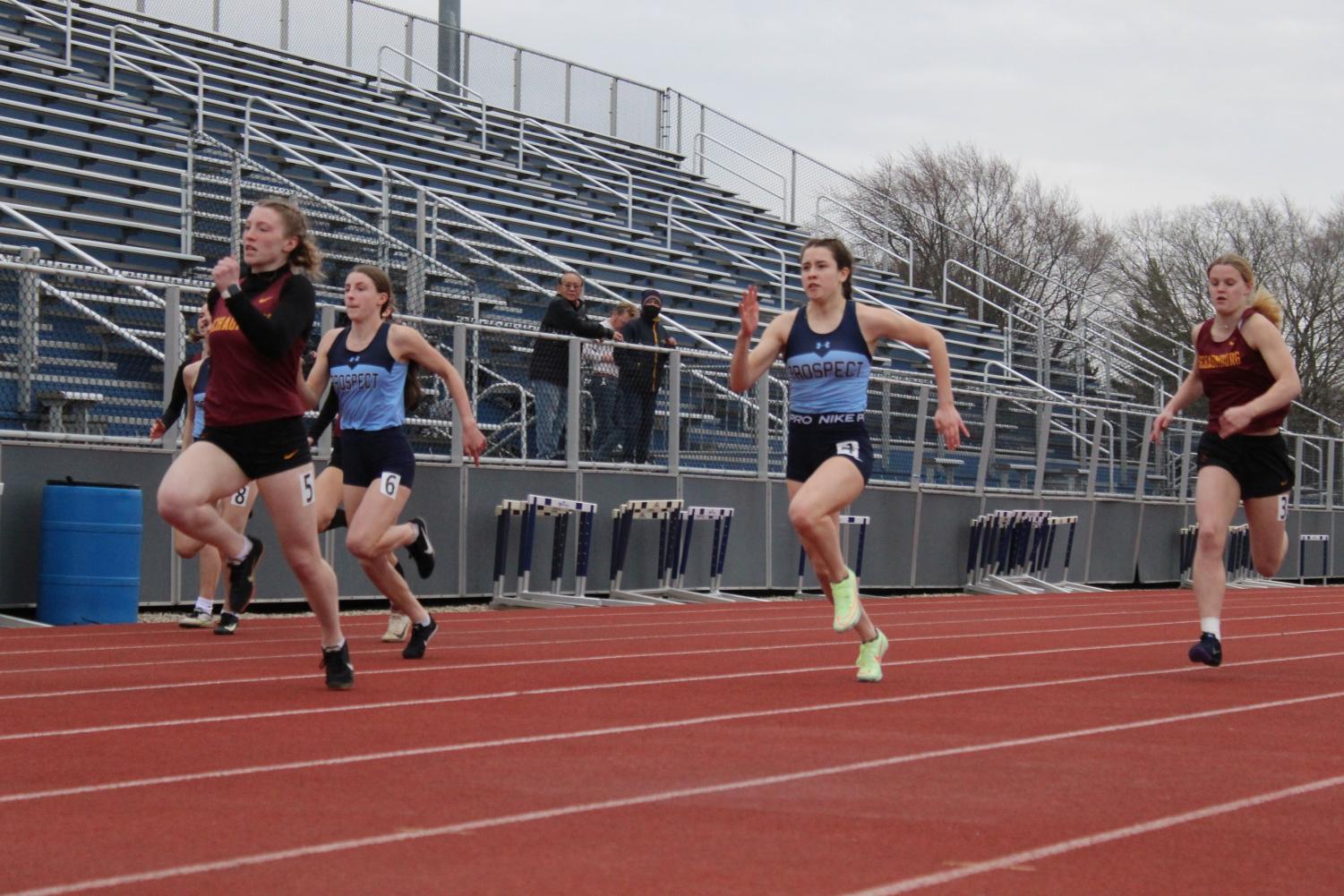 Emma Letzig and Kate Parisi compete in the 100 meter dash at a tri meet earlier in the season. (photo creds Alyssa Degan)