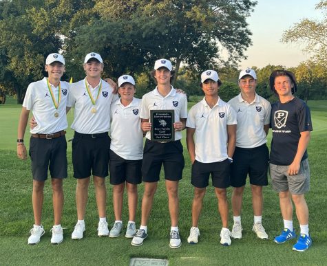 The boys golf team poses after their second-place finish at the Fremd Varsity Invite on Aug. 22. The team beat out reigning state champion Glenbrook North by four shots, only losing to last years state runner-up team, New Trier, by two strokes. (photo courtesy of James Hamann)