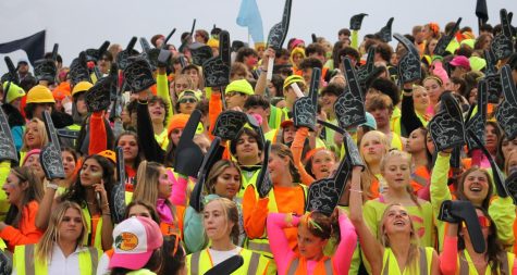 Decked out in neon, Prospect fans cheer loudly during the Hersey vs. Prospect game at George Gattas Memorial Stadium on September 23rd. (Photo by Priyanka Shah)