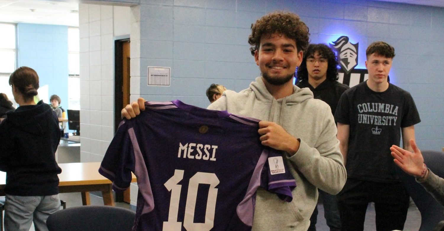 Gio Nunez-Morales proudly holds out his Messi jersey. I love the passion. I love the goals, the players, the fans, Nunez-Morales said.