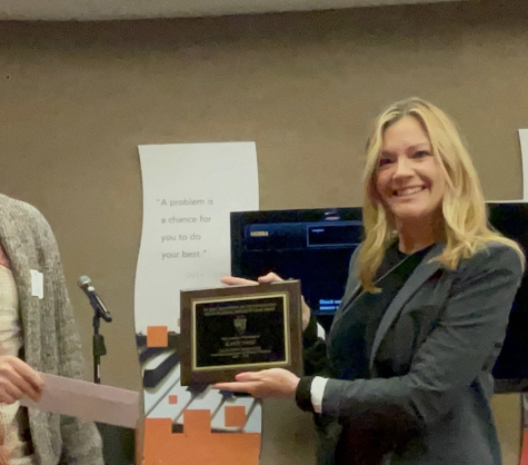 Prospect Physics teacher, Katie Page, accepts her award for Physics Teacher of the Year at Northern Illinois University. (Photo courtesy Dave Page)