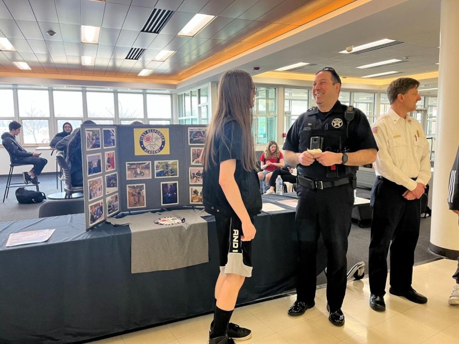 Officer Sill talks to potential students for the First Responders Program. (Photo by Alyssa Degan) 
