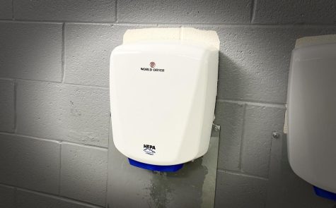 In Prospects bathrooms, hand dryers line the wall where paper towel holders once hung. (photo by Emma Letzig)
