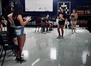 The cast of Spelling Bee rehearses their script in the Choir Room. Photo Courtesy of Justin Peabody

