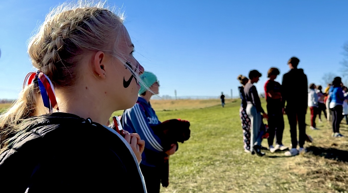Girls Cross Country warming up for upcoming Nationals