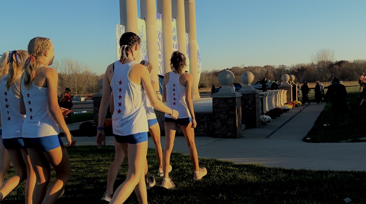 Girls Cross Country warming up for upcoming Nationals