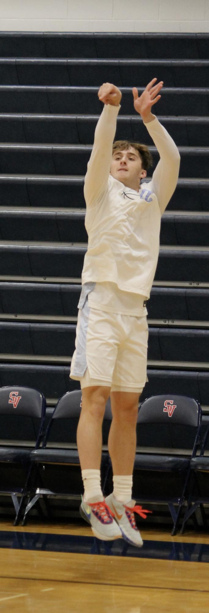 The Varsity Boys Basketball team at their last game of the St. Viator Tournament