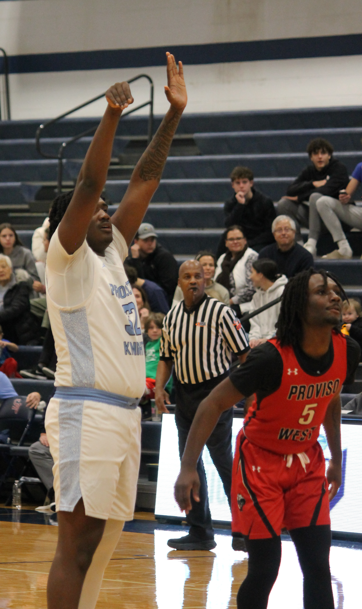 The Varsity Boys Basketball team at their last game of the St. Viator Tournament