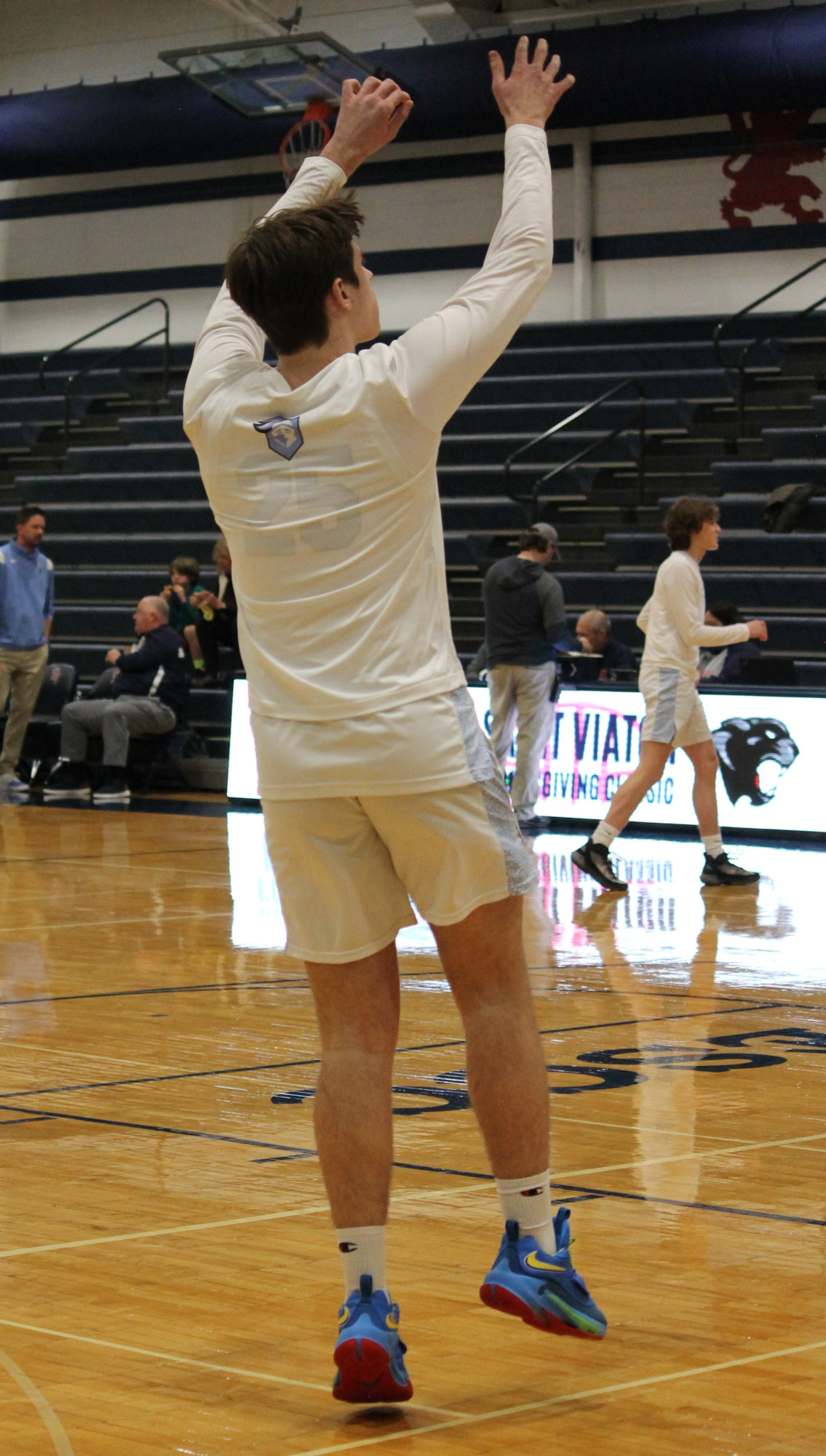 The Varsity Boys Basketball team at their last game of the St. Viator Tournament