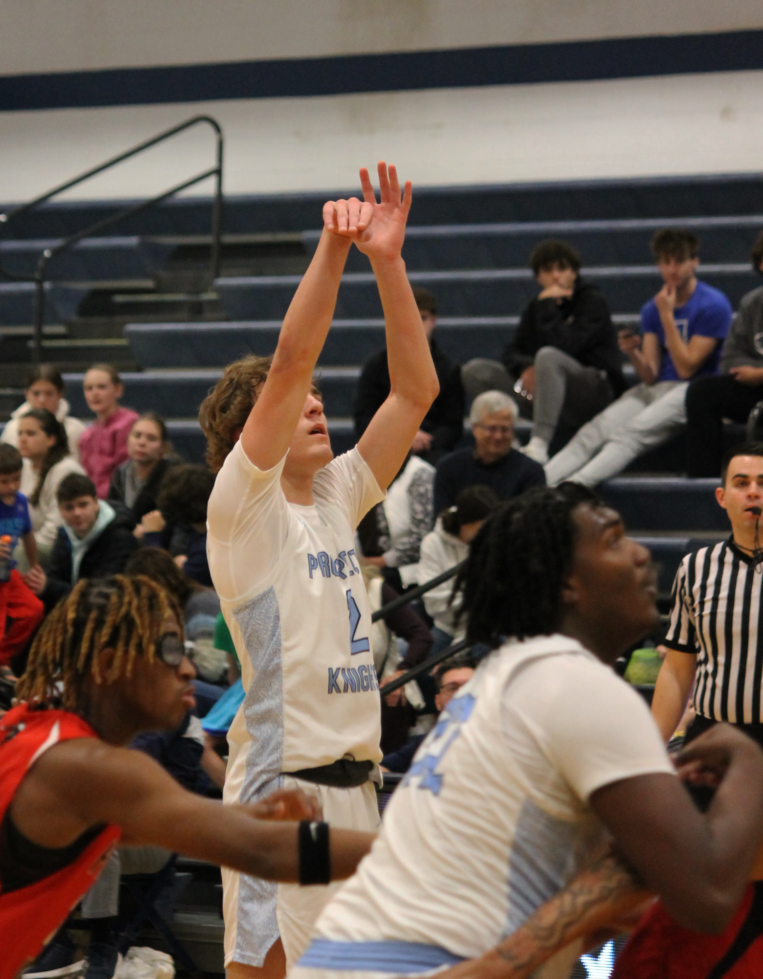 The Varsity Boys Basketball team at their last game of the St. Viator Tournament