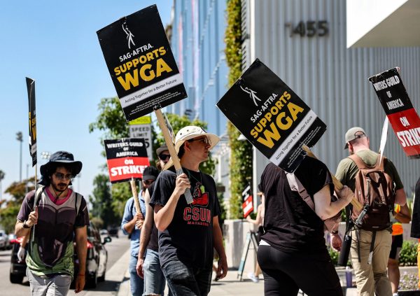 SAG-AFTRA members walk in solidarity with the screen actors strike outside the Netflix offices in Los Angeles. (Photo ourtesy of nbcnews.com)