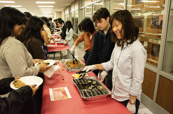Spanish teacher Cindy Pak serves Korean sushi at the EGHS Lunar New Year event.