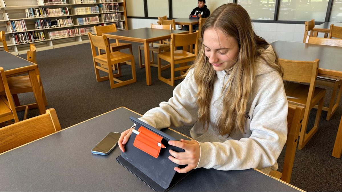 Junior Joanna Klaczak preps for the SAT by studying in Prospect’s library, where she can concentrate on practice problems.