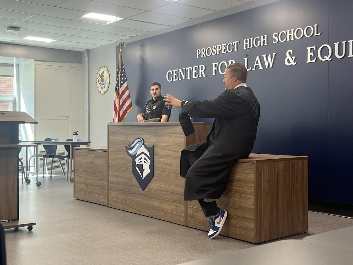 Law teacher Jay Heilman coaches student through the mock trials. He does this to help students have more confident and are successful in both the mock trials and in anything they do beyond Prospect law classes. 