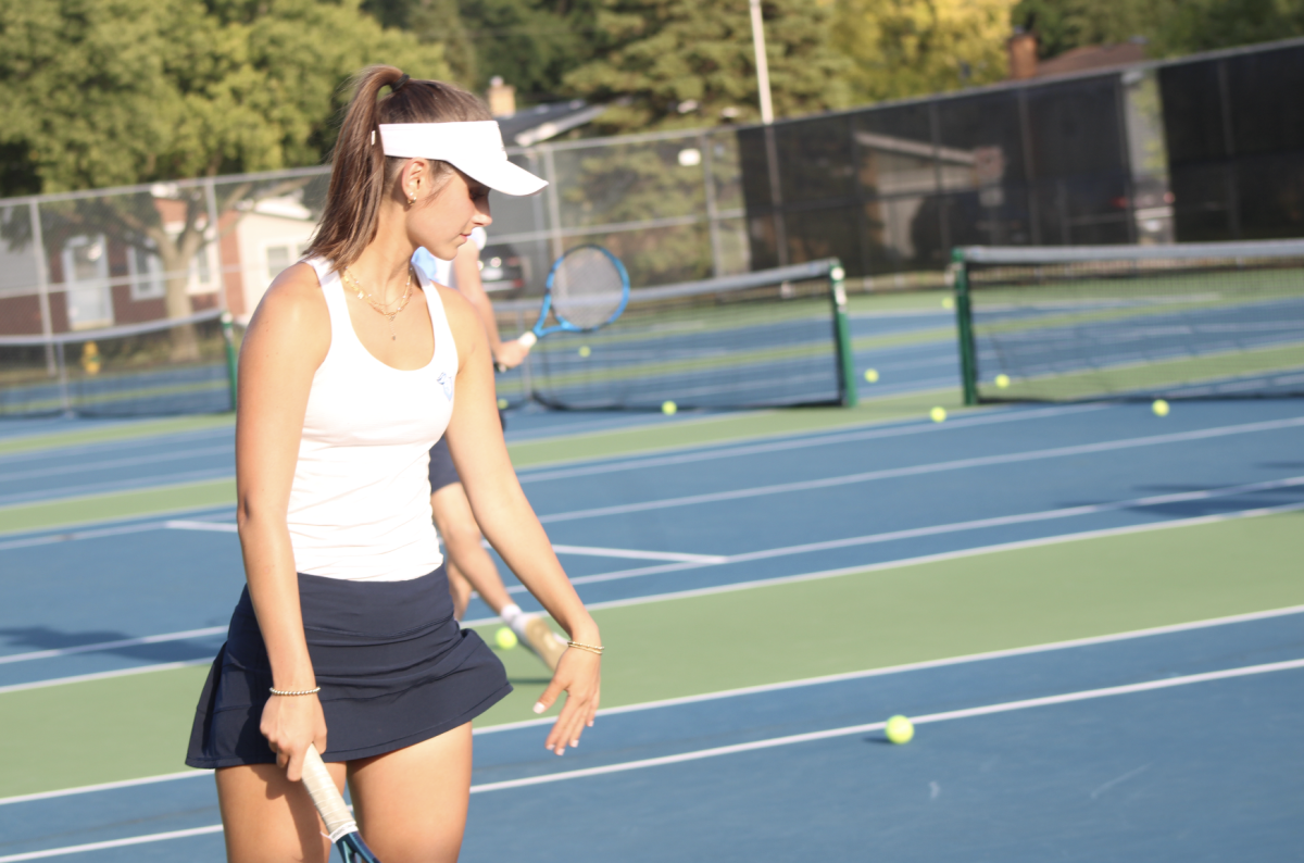 Sophomore Riley Philips gets ready to serve the ball.