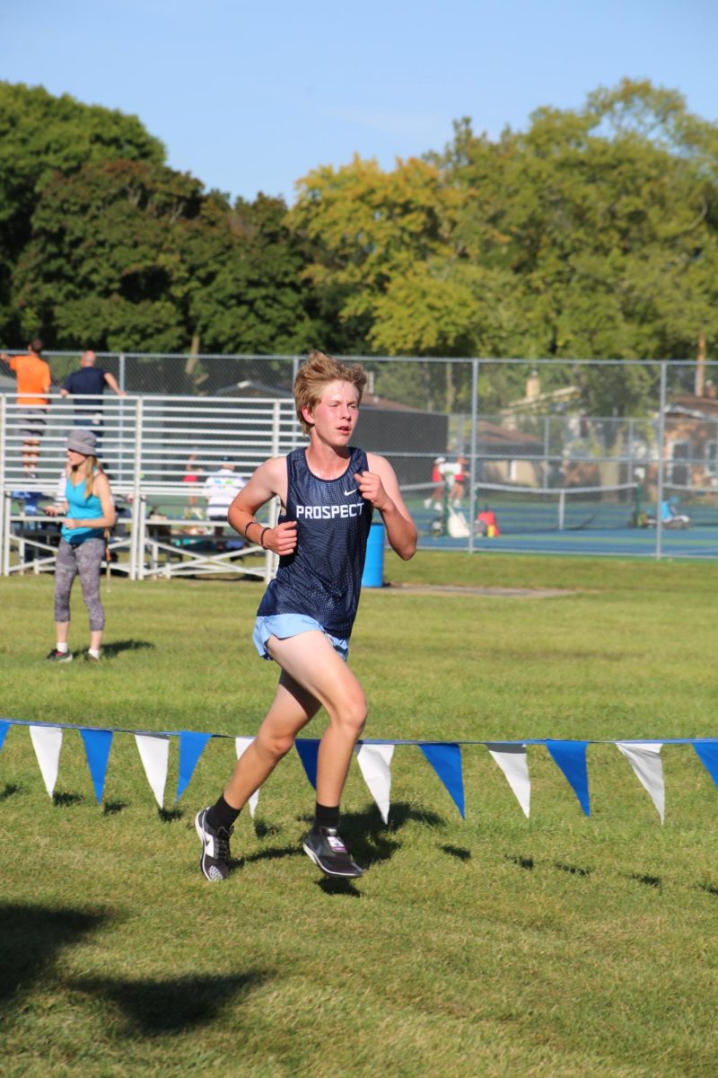 Freshman Noah John running the second lap of the 2.5 mile. 