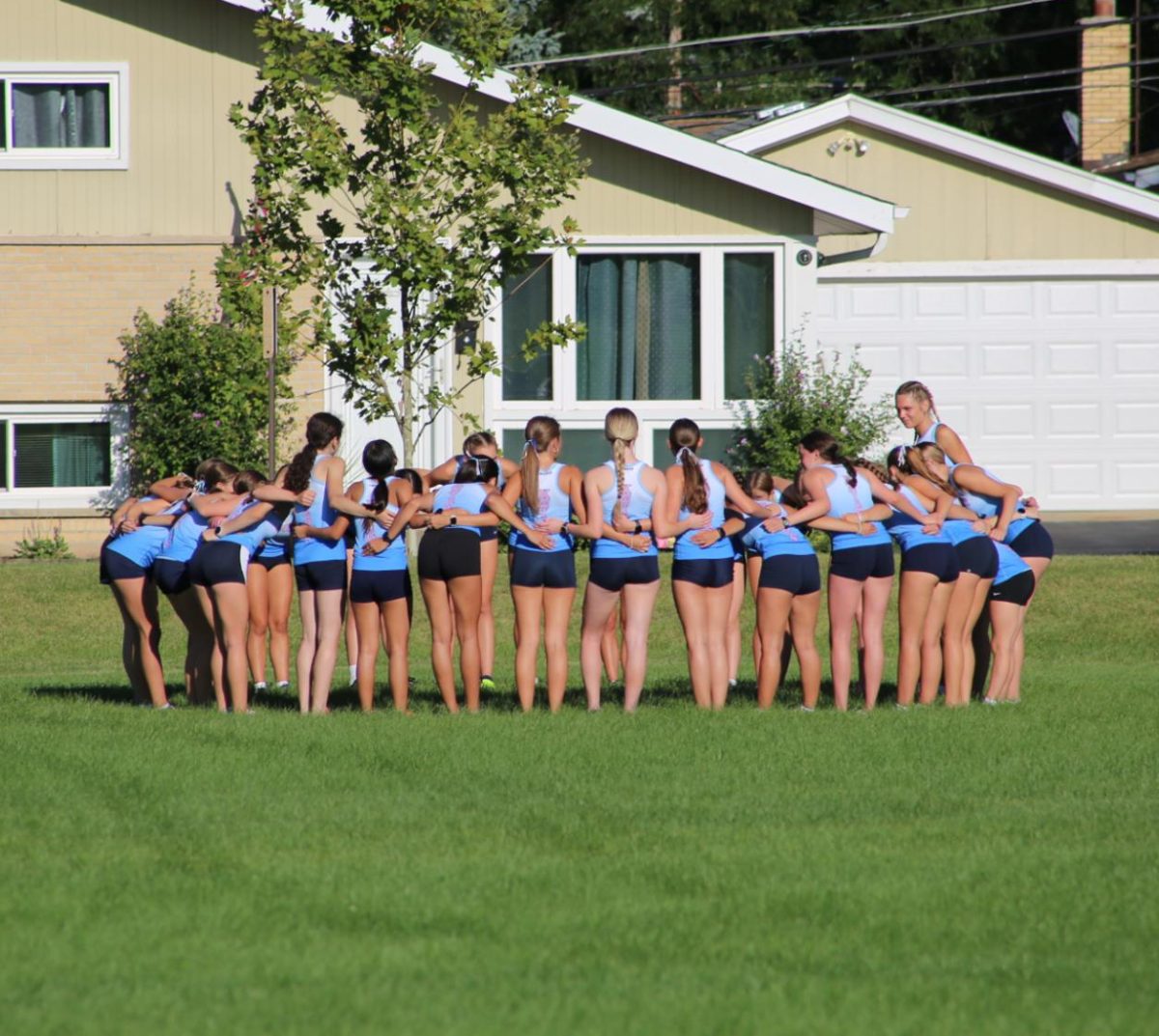 JV Cross Country girls huddle up before the first race of the season. 