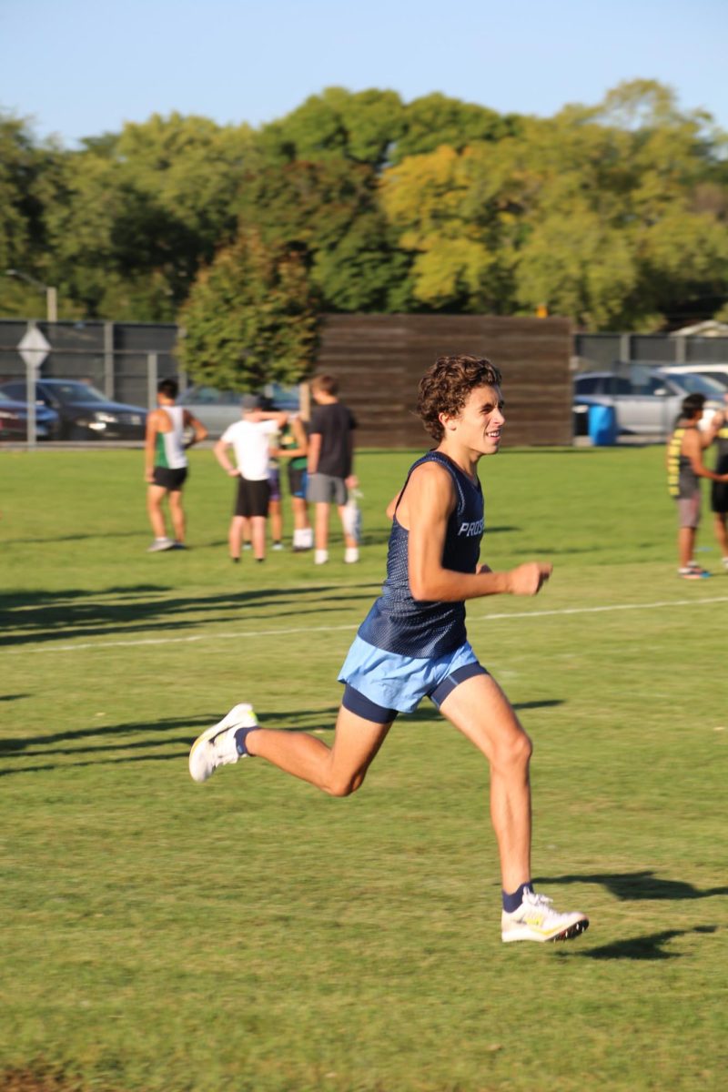 Junior Brody Cushing warming up for the 3 mile. 