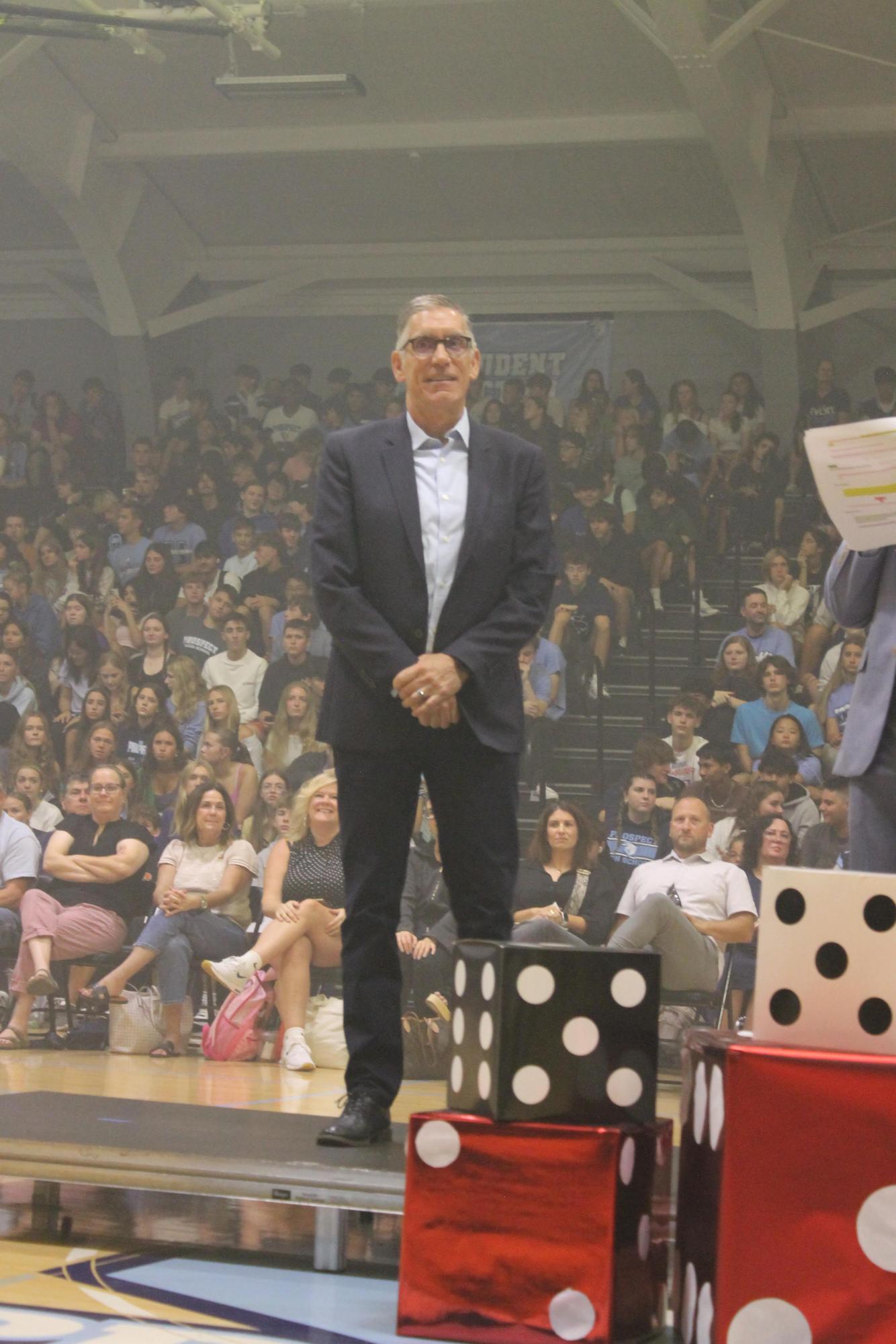 Alumni colonel Tim Ward is recognized for his achievements at the homecoming assembly