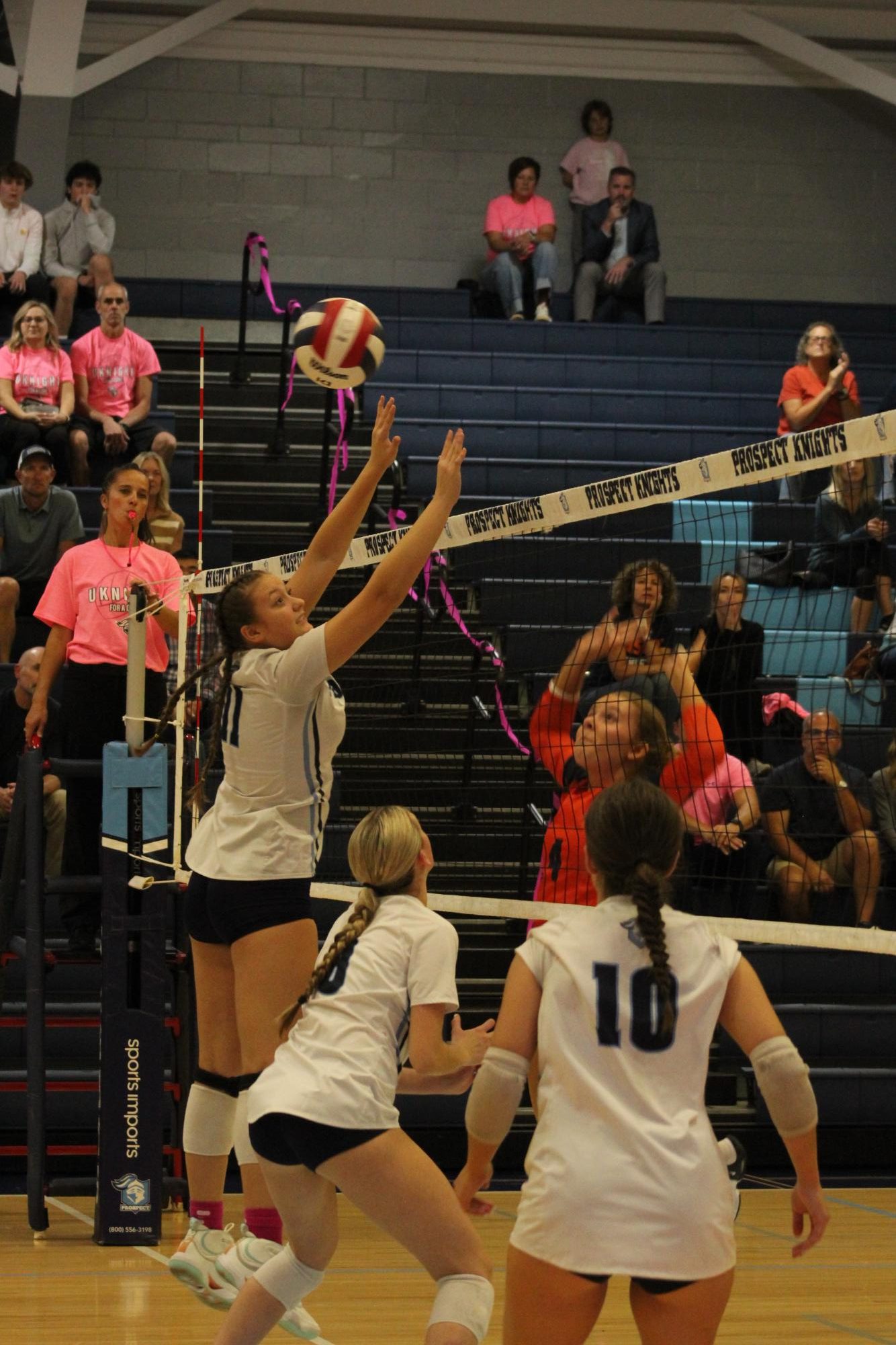 Junior Aimee Ciupeiu attempting to block the ball.