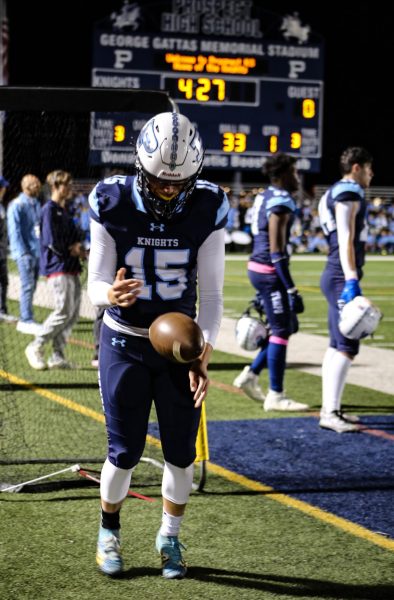 Senior Carter Cremascoli practicing on the sidelines. (Photo by Cora Richer)