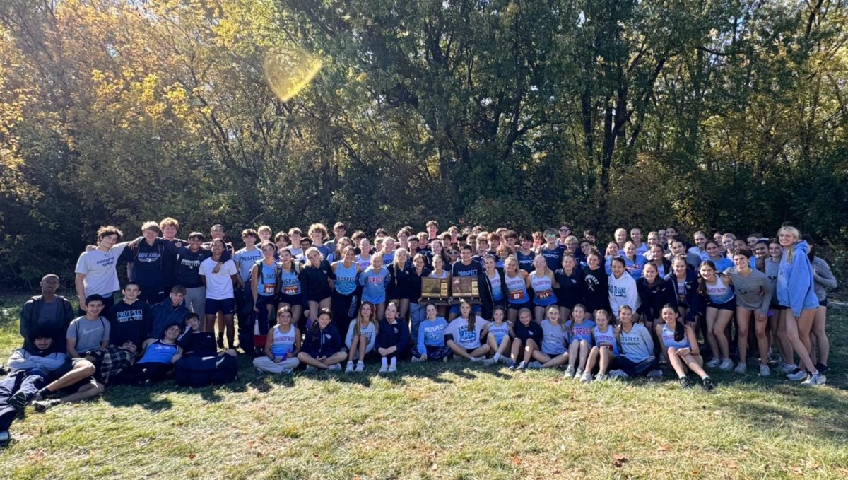 The cross country team poses post meet.