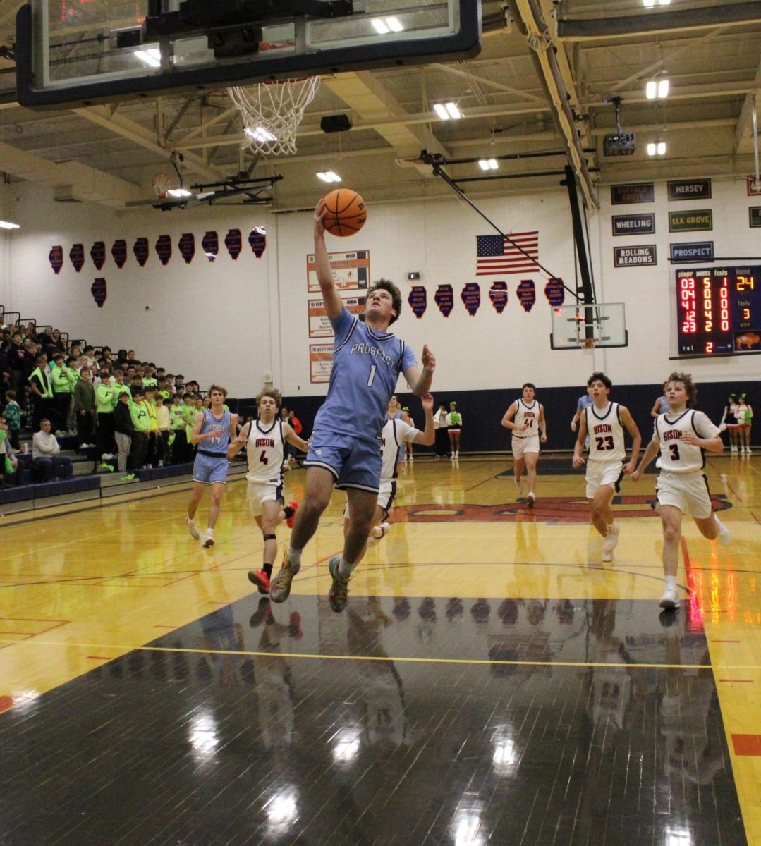 Senior Ben Schneider leaps toward the basket after a fast break. Schneider led the team — scoring 23 during Prospect’s 66-43 win over Buffalo Grove.
