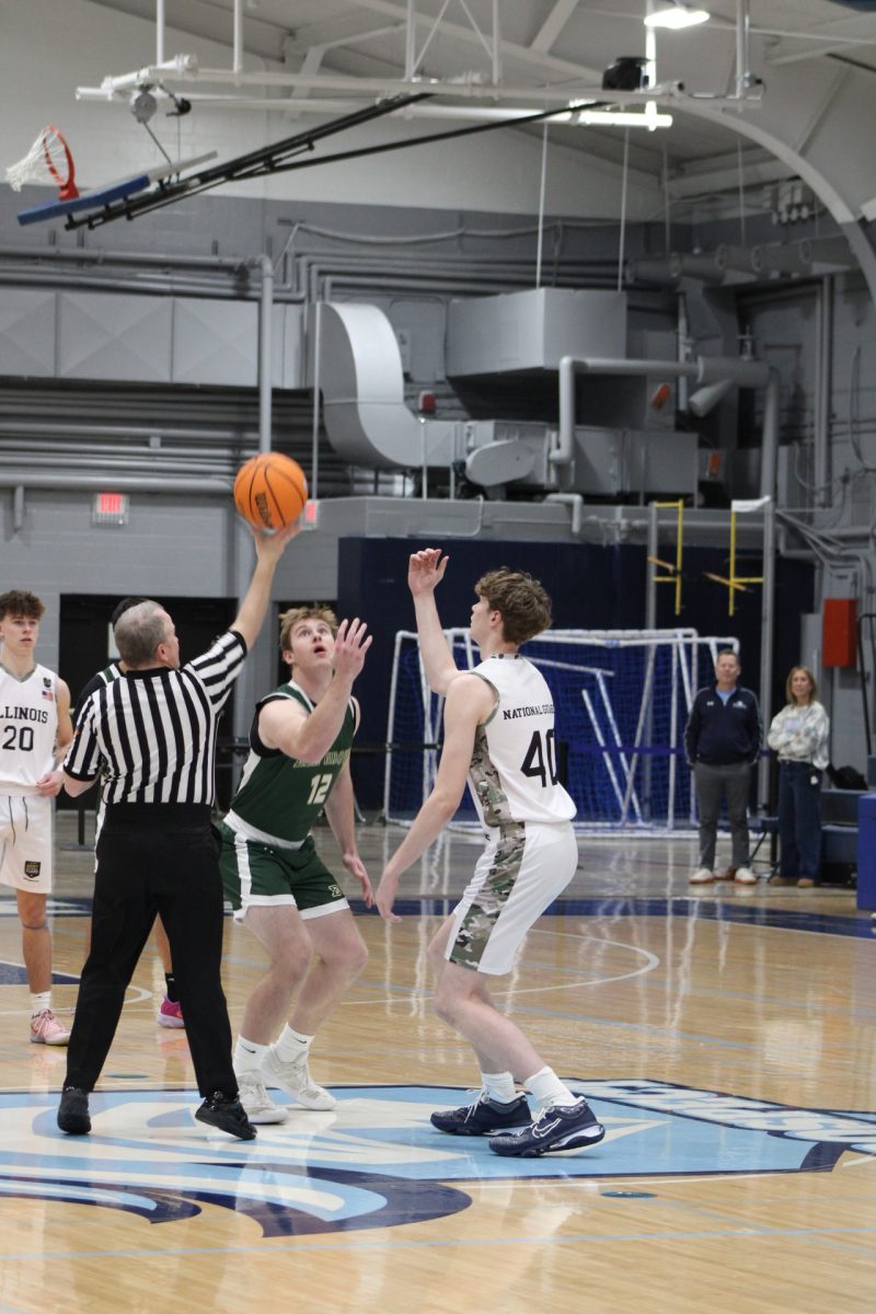 Junior Luke Christopulos during tip off.