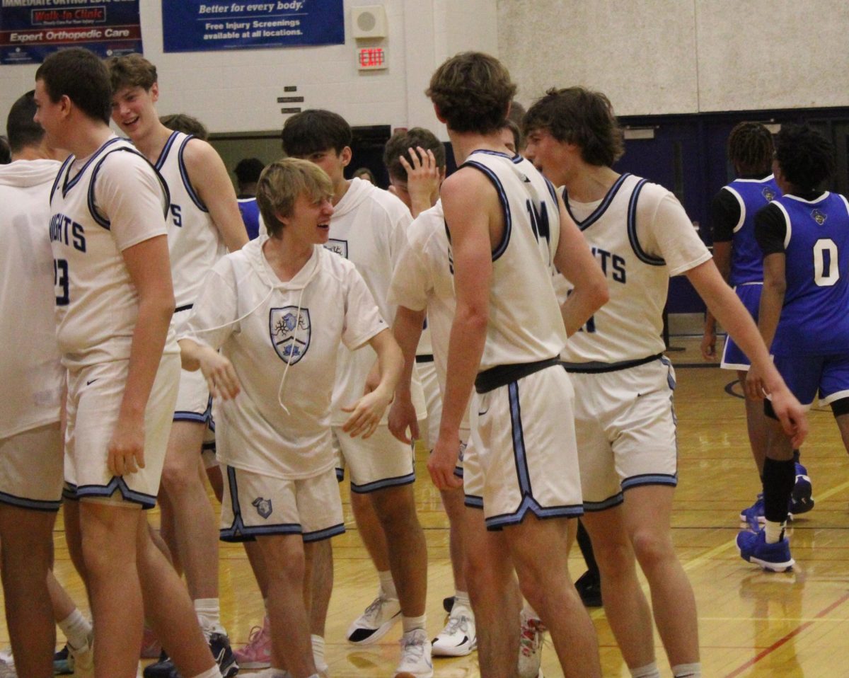 Seniors Will Friar (left) and Ryan Lifton (right) celebrate after consecutive 3-pointers made by the latter gave the Knights a comfortable lead over Proviso East. In addition to leading the team in points, Lifton shot 71% outside the 3-point arc, making five out of his seven 3-point attempts.