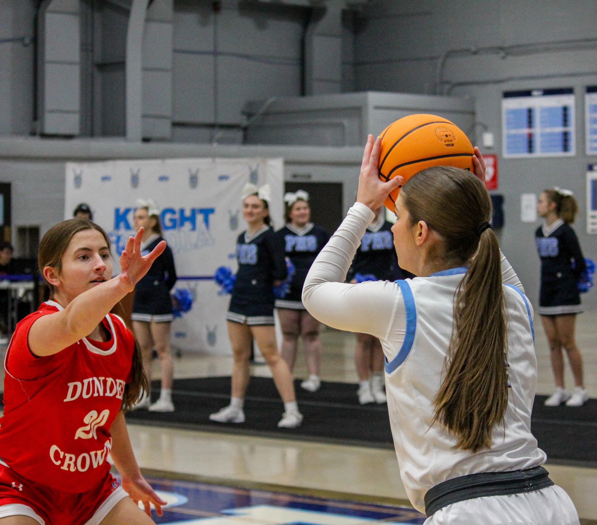 Junior Libby Mcdonough trying to pass the ball. 