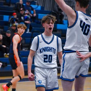 Junior Johnny Nellis celebrates after a great shot.