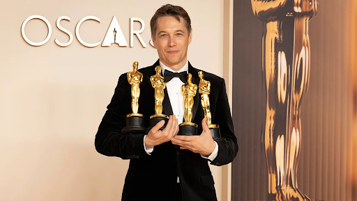 Sean Baker with his Oscars, photo credit Scott Kirkland/Disney via Getty Images