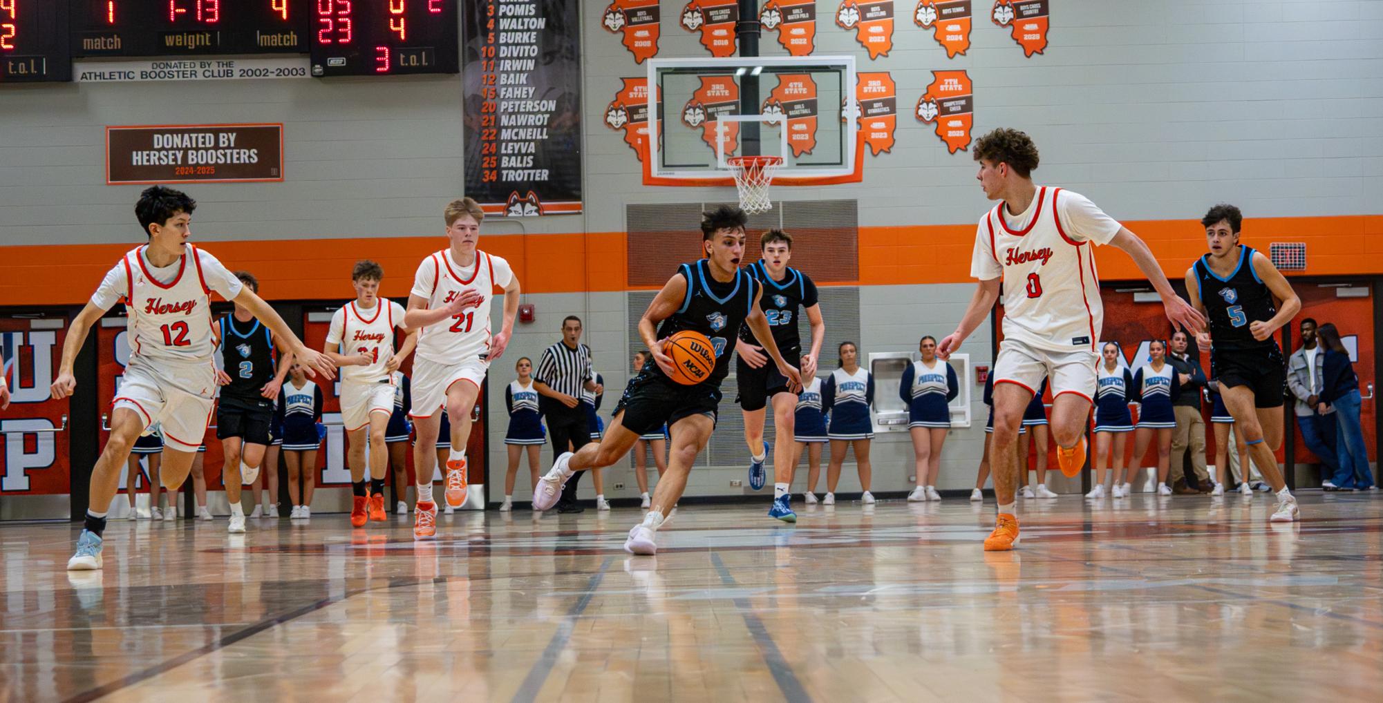 Boys basketball falls 55–37 to rival Hersey.