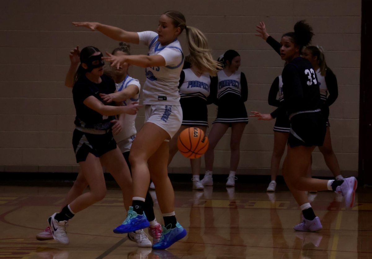 Senior Alli Linke blocking a Meadows player from passing the ball. 