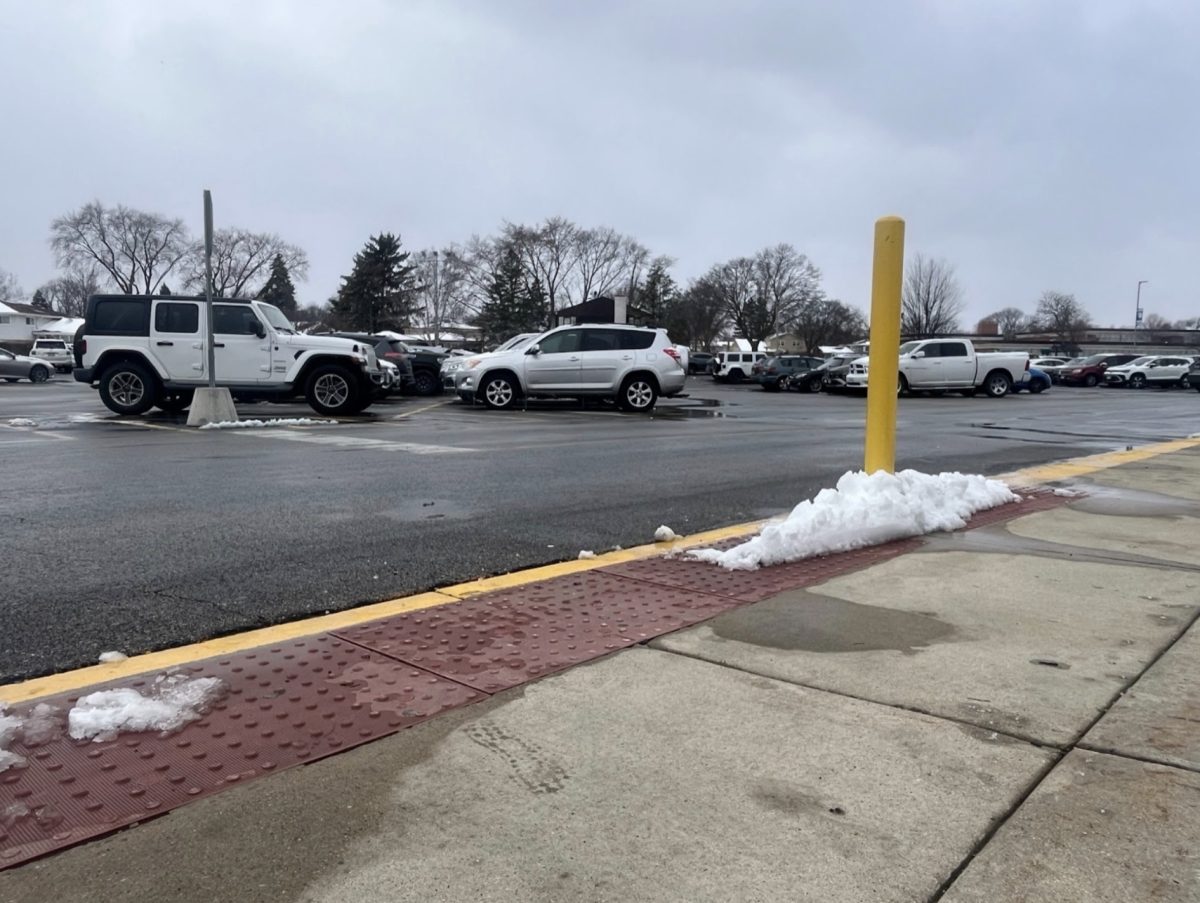 Parked cars sit in the Prospect parking lot.