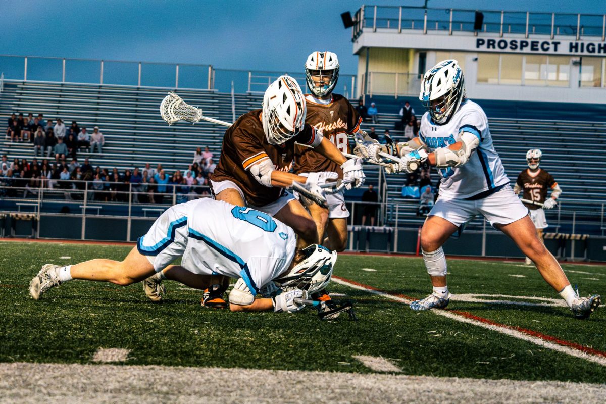 The Knights battle for a ground ball during Thursday's 10-1 loss.