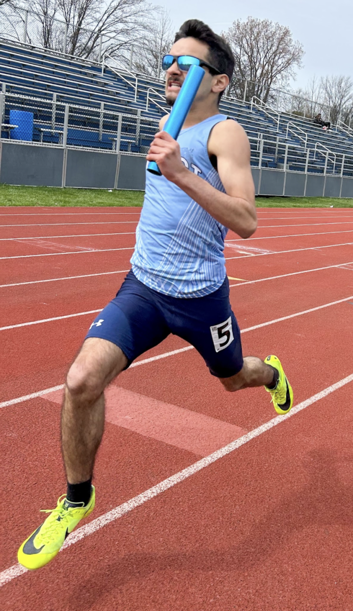 Sophomore Luigi Noe leads in the 4 x 100m race
