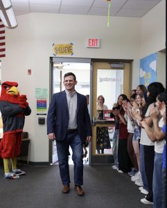 Family, friends and colleagues congratulate social studies teacher Seth Brady for being named Teacher of the Year on April 16. He was named by the Illinois State Board of Education. 